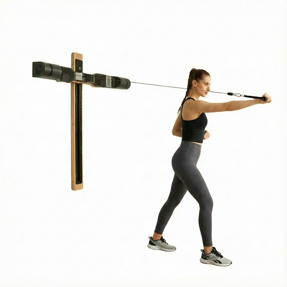 Woman using a resistance magnetic home gym machine with a wall mount on a white background
